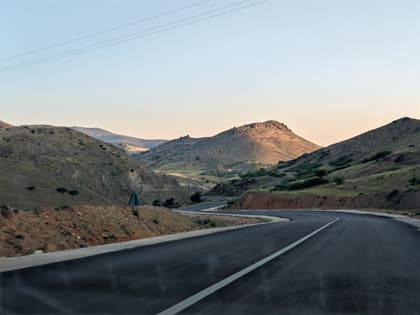 A road winding through dry hills